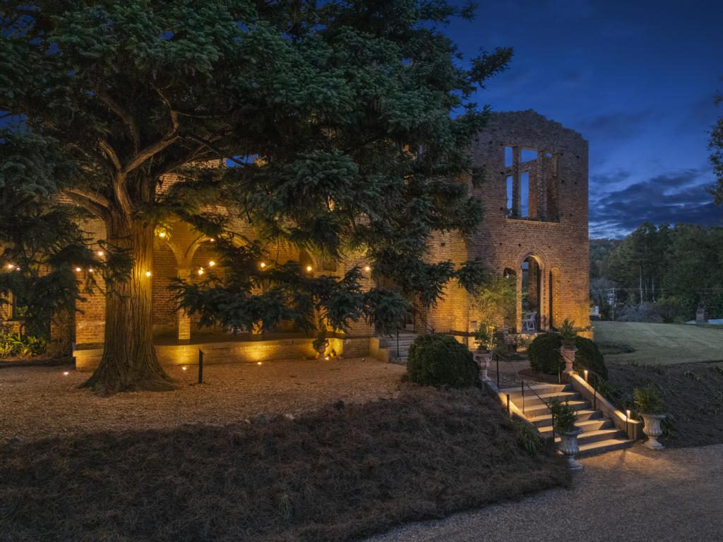 barnsley-gardens-historic-ruins-accent-lighting Historic Manor House Ruins at Barnsley Gardens illuminated with warm architectural and landscape lighting.